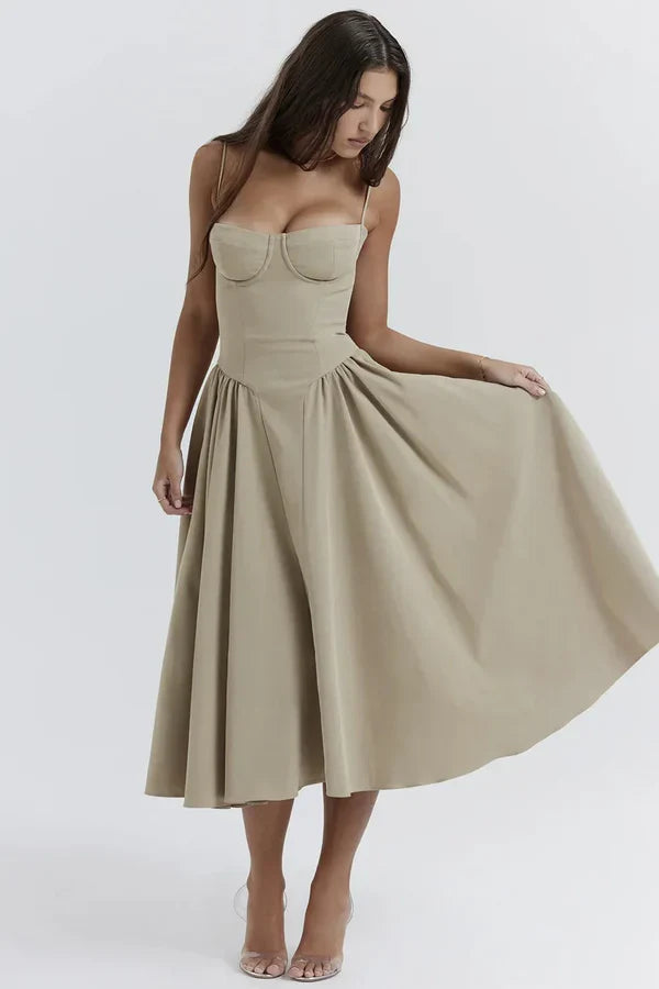 Woman wearing a beige dress on a white background